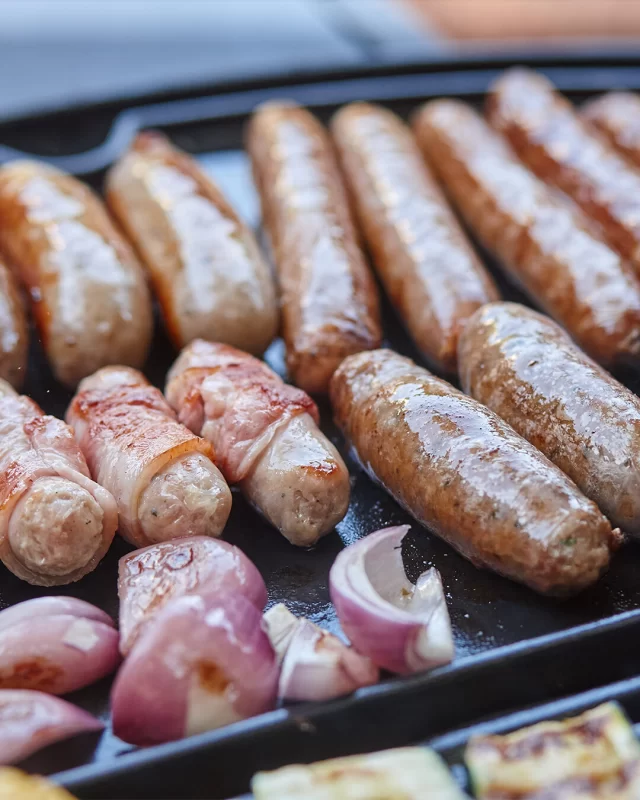 Long BBQ Beef Sausages, Thick Cumberland Sausages, Breakfast Pork Chipolatas wrapped in Streaky Bacon - this BBQ spread has something for everyone! What are you adding to your plate first?