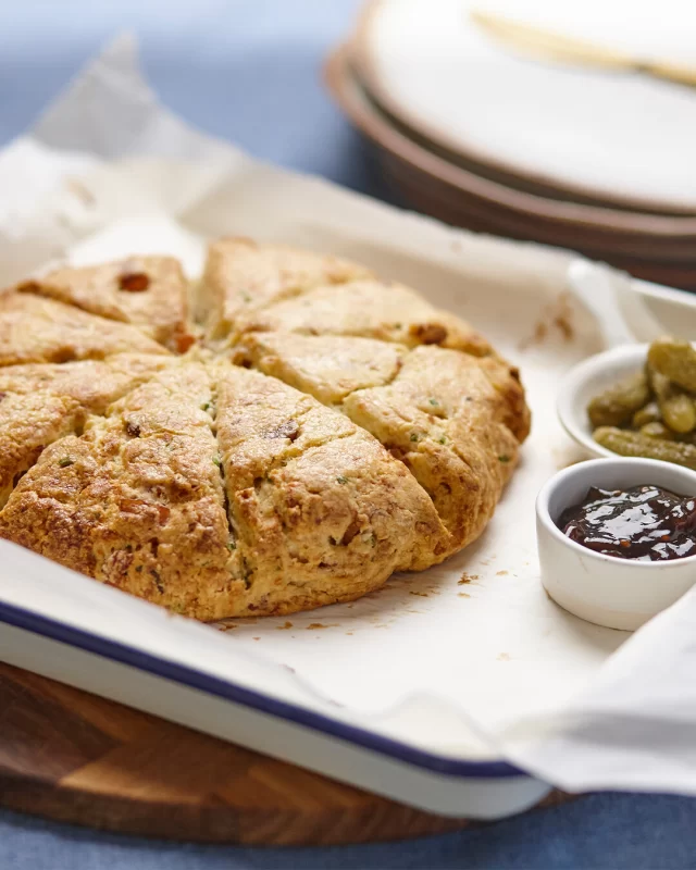 Looking for a fun and delicious afternoon to spend with your kids or grandkids this school holidays?Try making these Bacon & Cheddar Scones!SAVE THE RECIPE FOR LATER ⬇️INGREDIENTS
8 rashers (175g) British Smoked Streaky or Back Bacon, diced and well-cooked
2 1/2 cups (300g) plain flour
1 tbsp baking powder
1 tsp sugar
1/2 tsp salt
1/2 tsp cracked black pepper
6 tbsp (85g) cold unsalted butter, diced
1 cup grated cheddar or tasty cheese
2 tbsp finely chopped fresh chives (or spring onion)
3/4 cup (180ml) full cream milkMETHOD
1. Preheat your oven to 200°C (180°C fan). Line a baking tray with baking paper.
2. In a large mixing bowl, combine flour, baking powder, sugar, salt and pepper. Give it a quick stir or whisk through to ensure dry ingredients are mixed together thoroughly.
3. Add the diced butter and rub into the flour using your fingertips until it resembles coarse breadcrumbs.
4. Mix in cooked bacon, grated cheese and chopped chives until ingredients are evenly distributed.
5. Add in the milk and gently mix through until a dough forms. Do not overwork it.
6. Tip the dough onto a lightly floured surface. Pat it into a circle about 3cm thick. Transfer onto the lined baking tray, then cut dough into 8 wedges. Brush the scones with a little milk.
7. Bake in the oven and bake for 20-25 minutes, or until golden brown on top and cooked through.
8. When cooked, let slightly cool, then pull apart and enjoy. Best served with a side of pickles and a good dollop of relish or chutney. Don’t forget the cuppa!