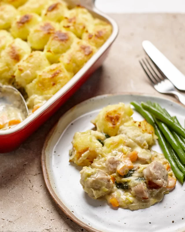 Kick off comforting season with a hearty Sausage & Mash Pie made with our Thick Cumberland Sausages 🔥Full recipe ⬇️INGREDIENTSPie filling:
500g British Sausage Co. Cumberland Sausages
1 tbsp olive oil
1 leek, finely chopped
2 cloves garlic, minced
1 carrot, diced
1 stalk celery, finely diced
1 tbsp plain flour
1 cup (250ml) chicken stock
3/4 cup (180ml) cream
1 tbsp Dijon mustard
Handful of baby spinach (optional)
Salt and pepper, to tasteMashed potato topping:
1.2kg potatoes, peeled and chopped
50g butter
1/3 cup milk
Salt and pepper, to tasteMETHOD
1. Make the mash: Place cut potatoes in a large pot of salted water and bring to boil. Cook until tender (about 15 mins), then drain well. Mash the potatoes with butter and milk until smooth and fluffy. Season with salt and pepper. Set aside.
2. Cook the sausages: While the potatoes are cooking, heat a fry pan over low to medium heat. Cook the sausages until golden and just cooked through. Remove and slice into bite-sized pieces.
3. Make the filling: In the same pan, add a splash of olive oil and sauté the leek, garlic, carrot and celery until soft (about 5-7 minutes). Stir in the flour and cook for 1 minute. Gradually add chicken stock while stirring to avoid lumps. Add cream and mustard and bring to a gentle simmer until thickened slightly. Toss in the sausages and spinach, then season to taste with salt and pepper. Let it bubble for another 2 minutes or until spinach wilts.
4. Assemble the pie: Preheat the oven to 200°C . Spoon the sausage filling into the baking dish. Using a spoon or ice cream scoop, place the mashed potato in rustic dollops over the filling.
5. Golden topping tip: For an extra golden top, drizzle the mashed potato with a little olive oil or melted butter. Or if you’re partial to a cheese, sprinkle some grated cheese over the mash topping before baking.
6. Bake: Place baking dish into the oven and bake for 25-30 minutes, or until the mash is golden on top and the filling is bubbling.
7. Serve: With a side of steamed green beans.#recipeidea #sausagerecipe #pierecipe #sausageandmashpie #sausageandmashrecipe